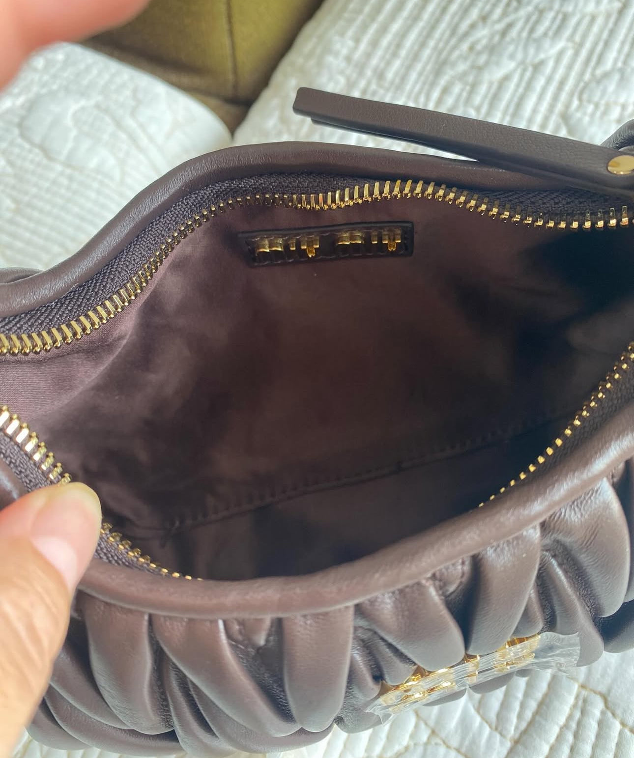 Wander matelassé nappa leather hobo bag | MIU
