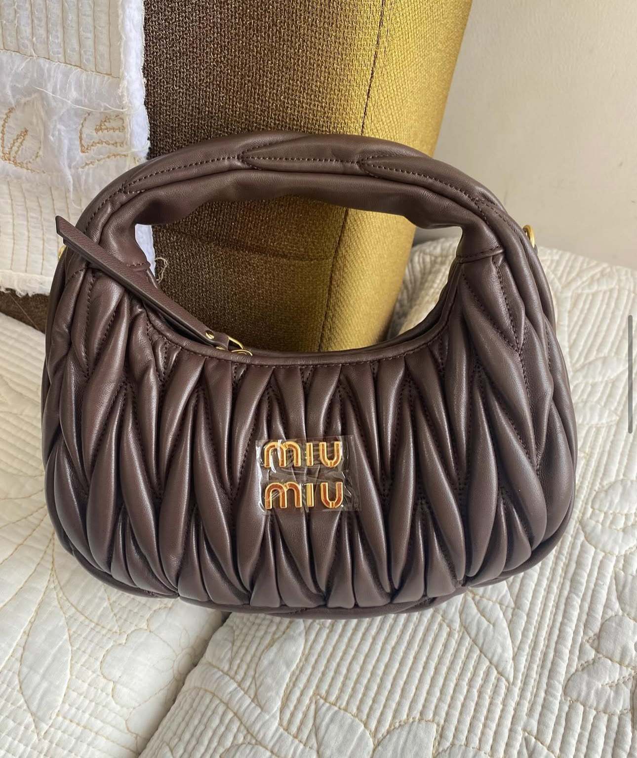 Wander matelassé nappa leather hobo bag | MIU