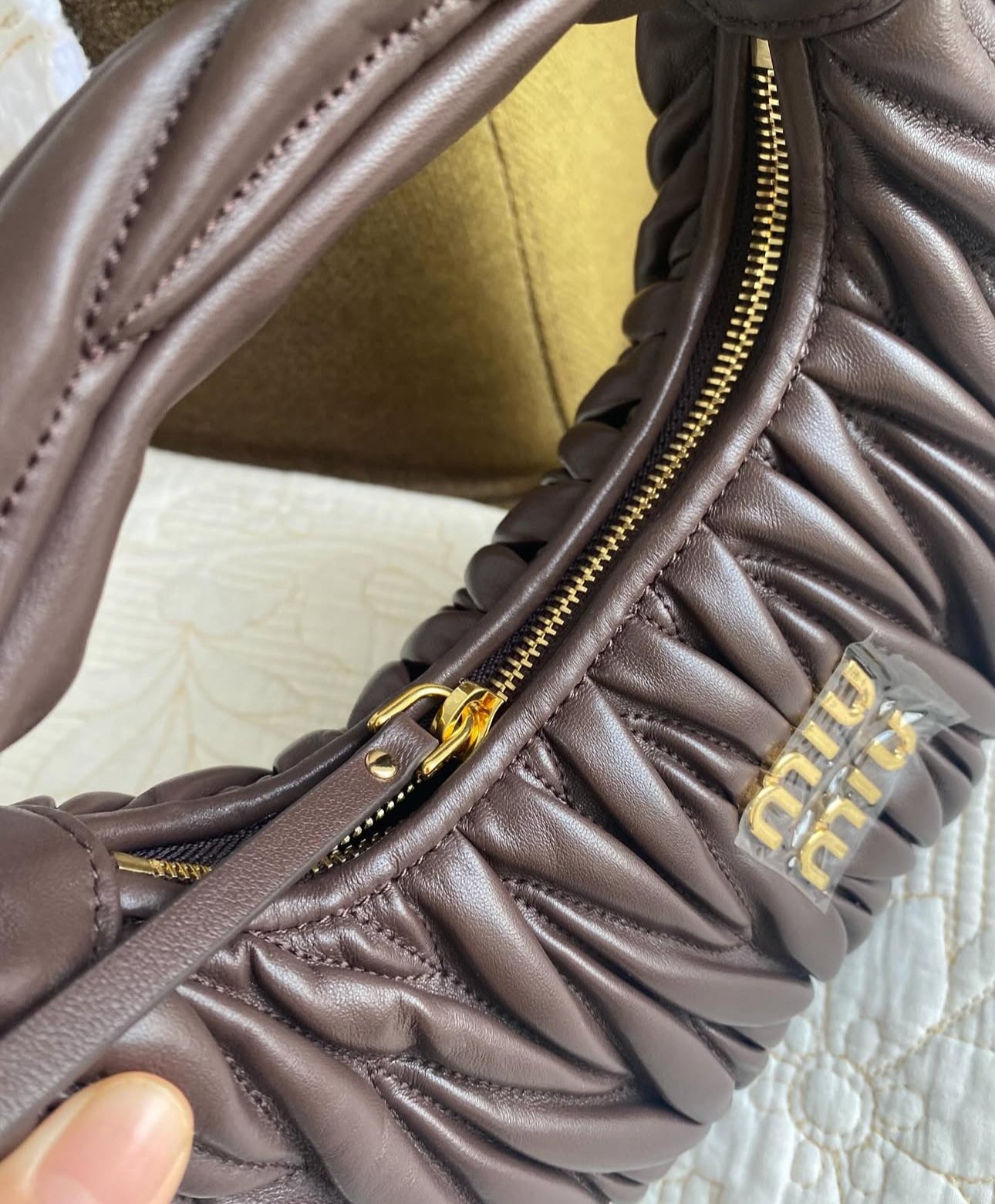 Wander matelassé nappa leather hobo bag | MIU