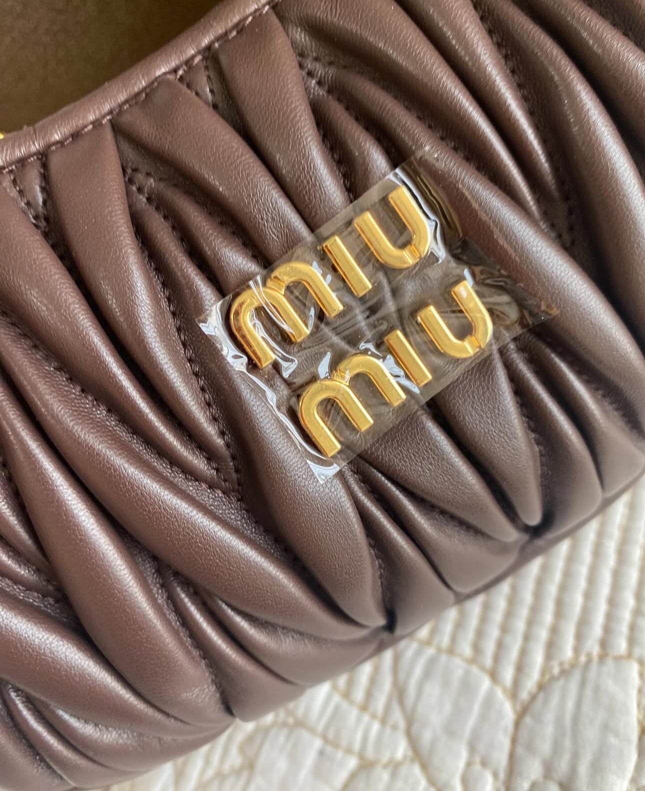 Wander matelassé nappa leather hobo bag | MIU