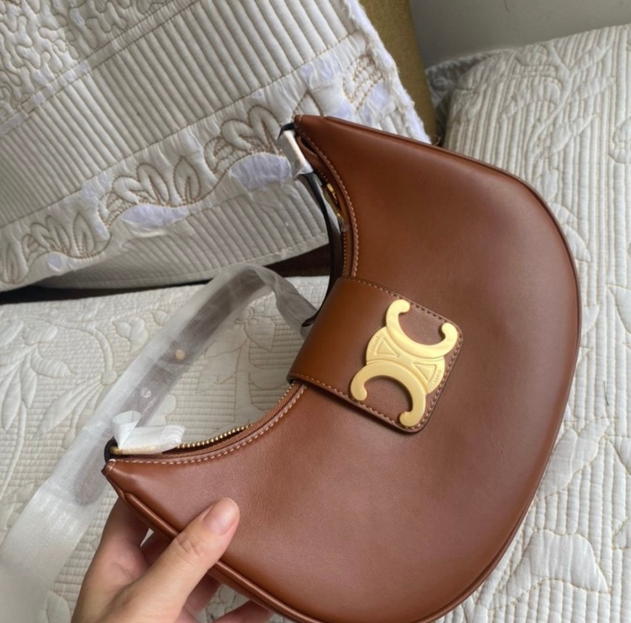 Tan Ava Triomphe bag in smooth calfskin