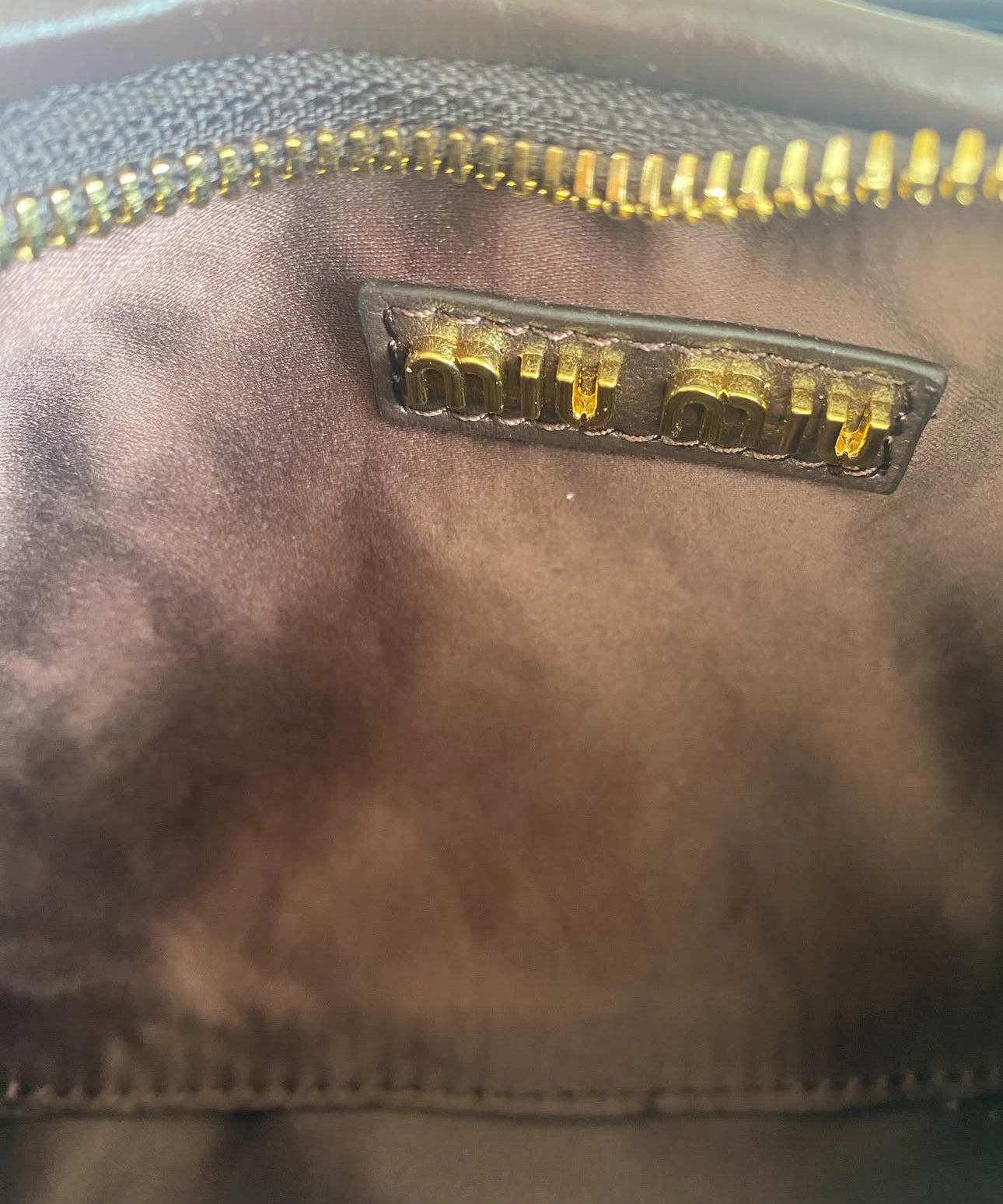 Wander matelassé nappa leather hobo bag | MIU