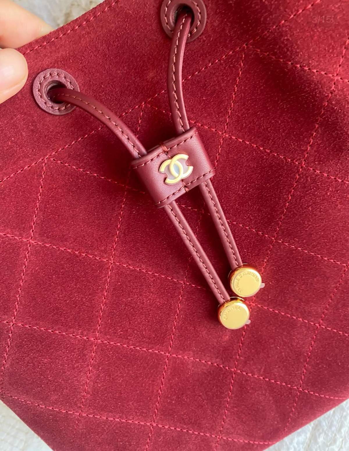 “CC Loop" Drawstring Bucket Bag in dark burgundy