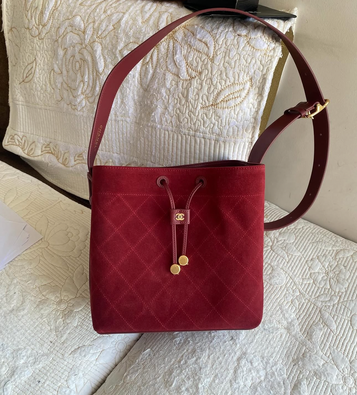 “CC Loop" Drawstring Bucket Bag in dark burgundy
