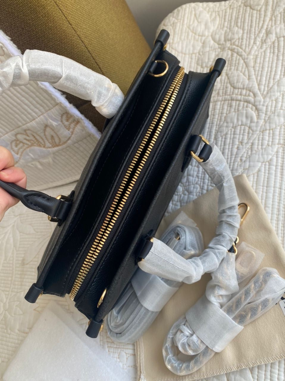 Black OnTheGo East West Monogram Empreinte Leather